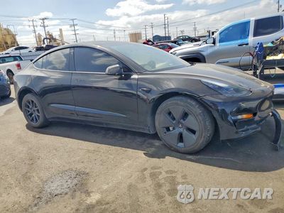 Czwarte zdjęcie samochodu z boku: 2023 TESLA MODEL 3 VIN:5YJ3E1EB7PF662765 - miniatura