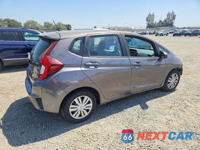 Trzecie zdjęcie samochodu z tyłu: 2017 HONDA FIT LX VIN:JHMGK5H50HS000519 - miniatura
