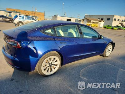 Trzecie zdjęcie samochodu z tyłu: 2023 TESLA MODEL 3 VIN:5YJ3E1EA5PF542955 - miniatura