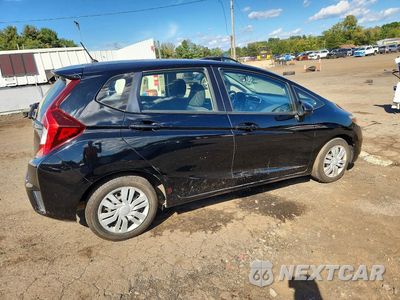 Trzecie zdjęcie samochodu z tyłu: 2016 HONDA FIT LX VIN:JHMGK5H59GX018521 - miniatura