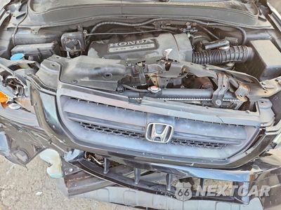 Zdjęcie 11 z 12 samochodu: 2005 HONDA PILOT EX VIN:2HKYF184X5H551318 - miniatura