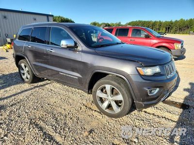 Czwarte zdjęcie samochodu z boku: 2014 JEEP GRAND CHEROKEE OVERLAND VIN:1C4RJFCG9EC272620 - miniatura