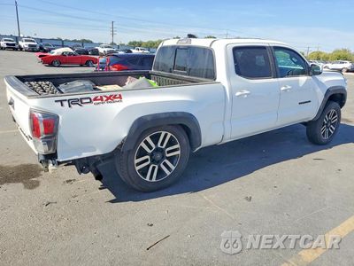 Trzecie zdjęcie samochodu z tyłu: 2021 TOYOTA TACOMA TRD OFF-ROAD VIN:3TMDZ5BNXMM118931 - miniatura