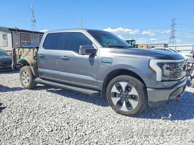 Czwarte zdjęcie samochodu z boku: 2023 FORD F150 LIGHTNING PRO VIN:1FT6W1EV7PWG16482 - miniatura