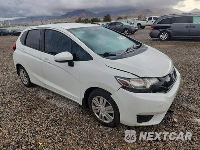 Czwarte zdjęcie samochodu z boku: 2015 HONDA FIT LX VIN:3HGGK5H5XFM757114 - miniatura