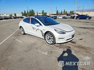 Czwarte zdjęcie samochodu z boku: 2019 TESLA MODEL 3 VIN:5YJ3E1EA5KF432125 - miniatura