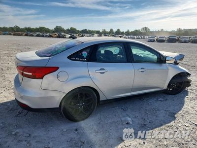Trzecie zdjęcie samochodu z tyłu: 2016 FORD FOCUS SE VIN:1FADP3F20GL307657 - miniatura