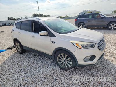 Czwarte zdjęcie samochodu z boku: 2017 FORD ESCAPE TITANIUM VIN:1FMCU9JD8HUC90110 - miniatura