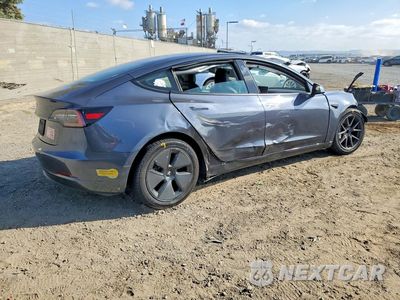 Trzecie zdjęcie samochodu z tyłu: 2021 TESLA MODEL 3 VIN:5YJ3E1EA1MF940076 - miniatura