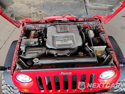 Zdjęcie 11 z 12 samochodu: 2012 JEEP WRANGLER UNLIMITED SAHARA VIN:1C4BJWEGXCL188981 - miniatura