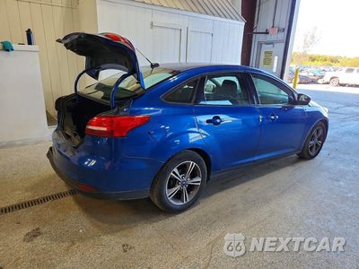 Trzecie zdjęcie samochodu z tyłu: 2018 FORD FOCUS SE VIN:1FADP3F22JL243645 - miniatura