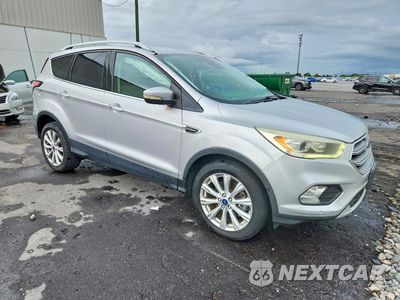 Czwarte zdjęcie samochodu z boku: 2017 FORD ESCAPE TITANIUM VIN:1FMCU9JD8HUC82329 - miniatura