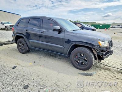 Czwarte zdjęcie samochodu z boku: 2012 JEEP GRAND CHEROKEE LAREDO VIN:1C4RJFAG8CC246168 - miniatura