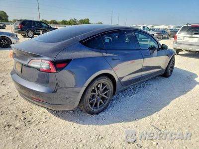 Trzecie zdjęcie samochodu z tyłu: 2023 TESLA MODEL 3 VIN:5YJ3E1EA0PF460308 - miniatura