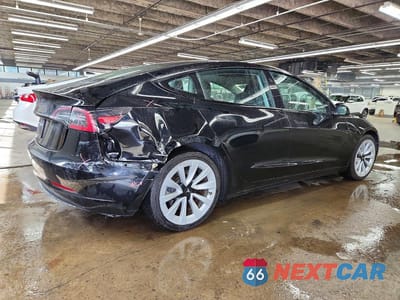 Trzecie zdjęcie samochodu z tyłu: 2022 TESLA MODEL 3 VIN:5YJ3E1EA1NF369335 - miniatura