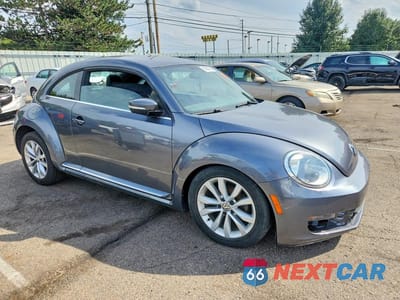 Czwarte zdjęcie samochodu z boku: 2014 VOLKSWAGEN BEETLE VIN:3VWJL7AT7EM647400 - miniatura