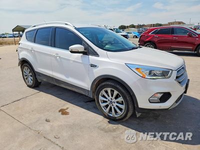 Czwarte zdjęcie samochodu z boku: 2017 FORD ESCAPE TITANIUM VIN:1FMCU0J90HUA38603 - miniatura