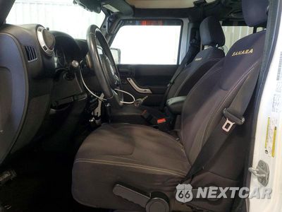 Zdjęcie 7 z 12 samochodu: 2013 JEEP WRANGLER UNLIMITED SAHARA VIN:1C4BJWEG2DL567846 - miniatura