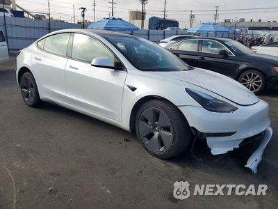 Czwarte zdjęcie samochodu z boku: 2023 TESLA MODEL 3 VIN:5YJ3E1EA8PF686399 - miniatura