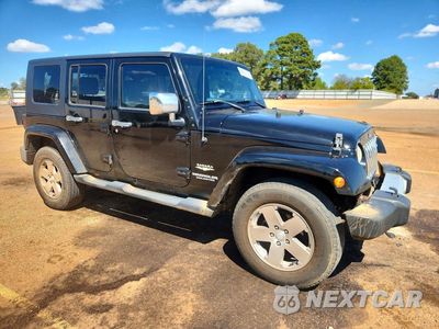 Czwarte zdjęcie samochodu z boku: 2009 JEEP WRANGLER UNLIMITED SAHARA VIN:1J4GA59159L772763 - miniatura
