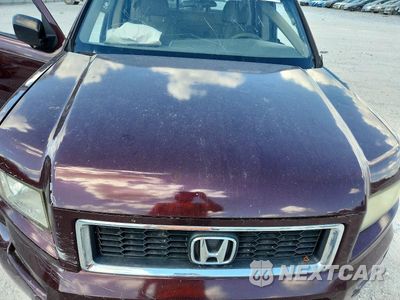 Zdjęcie 11 z 12 samochodu: 2007 HONDA RIDGELINE RTX VIN:2HJYK16307H541488 - miniatura