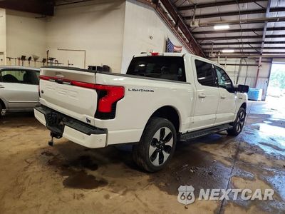 Trzecie zdjęcie samochodu z tyłu: 2023 FORD F150 LIGHTNING PRO VIN:1FT6W1EV8PWG02073 - miniatura