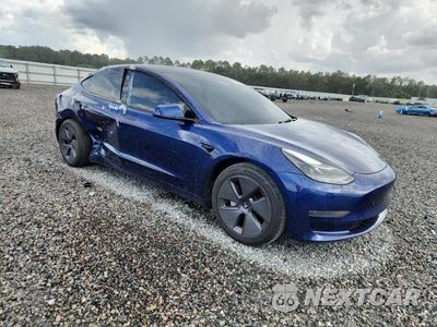 Czwarte zdjęcie samochodu z boku: 2023 TESLA MODEL 3 VIN:5YJ3E1EA6PF554564 - miniatura