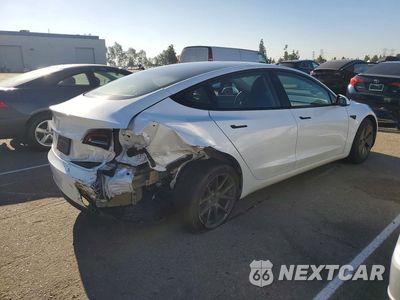 Trzecie zdjęcie samochodu z tyłu: 2023 TESLA MODEL 3 VIN:5YJ3E1EA8PF502983 - miniatura