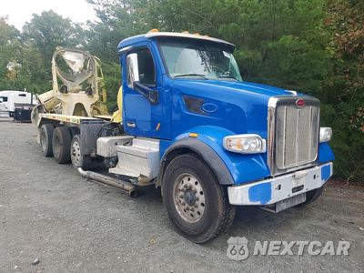 Czwarte zdjęcie samochodu z boku: 2022 PETERBILT 567 READY MIX TRUCK VIN:1NPCXKEX0ND779676 - miniatura