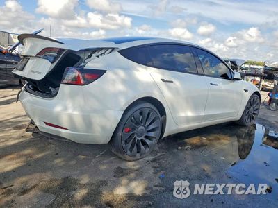 Trzecie zdjęcie samochodu z tyłu: 2023 TESLA MODEL 3 VIN:5YJ3E1EC8PF499813 - miniatura