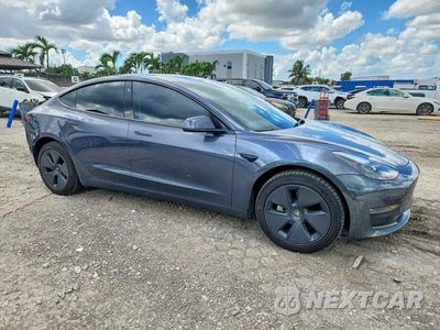 Czwarte zdjęcie samochodu z boku: 2023 TESLA MODEL 3 VIN:5YJ3E1EB3PF660074 - miniatura