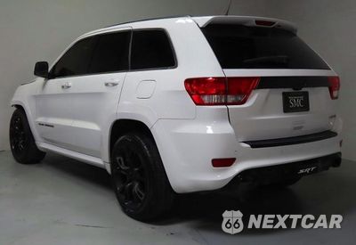 Czwarte zdjęcie samochodu z boku: 2013 JEEP GRAND CHEROKEE SRT-8 VIN:1C4RJFDJ4DC563714 - miniatura
