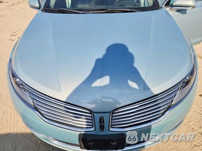 Zdjęcie 11 z 12 samochodu: 2014 LINCOLN MKZ HYBRID VIN:3LN6L2LU4ER811251 - miniatura