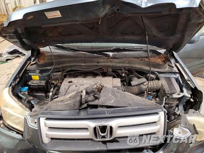 Zdjęcie 12 z 13 samochodu: 2006 HONDA PILOT EX VIN:2HKYF18526H512636 - miniatura