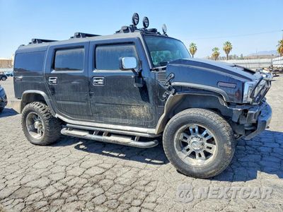 Czwarte zdjęcie samochodu z boku: 2003 HUMMER H2 VIN:5GRGN23U63H132744 - miniatura