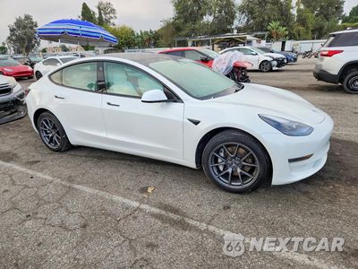 Czwarte zdjęcie samochodu z boku: 2021 TESLA MODEL 3 VIN:5YJ3E1EA8MF028836 - miniatura