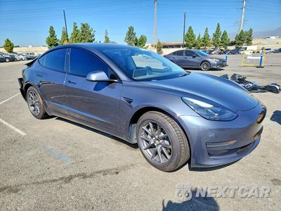 Czwarte zdjęcie samochodu z boku: 2021 TESLA MODEL 3 VIN:5YJ3E1EA9MF092772 - miniatura