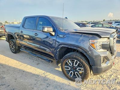 Czwarte zdjęcie samochodu z boku: 2021 GMC SIERRA K1500 AT4 VIN:1GTU9EET5MZ242419 - miniatura