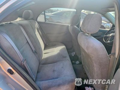 Zdjęcie 10 z 13 samochodu: 2003 TOYOTA COROLLA LE VIN:JTDBR32E130041010 - miniatura