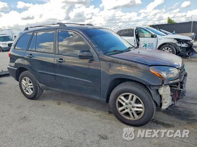 Czwarte zdjęcie samochodu z boku: 2003 TOYOTA RAV4 BASE VIN:JTEGH20V730092920 - miniatura
