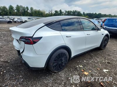 Trzecie zdjęcie samochodu z tyłu: 2023 TESLA MODEL Y VIN:7SAYGAEE9PF776974 - miniatura