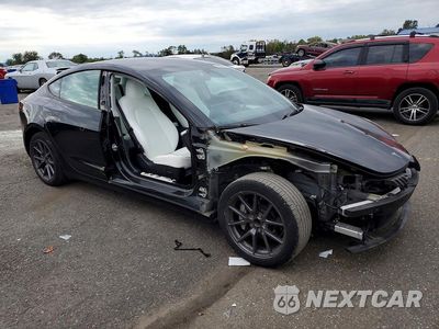 Czwarte zdjęcie samochodu z boku: 2023 TESLA MODEL 3 VIN:5YJ3E1EA1PF643488 - miniatura