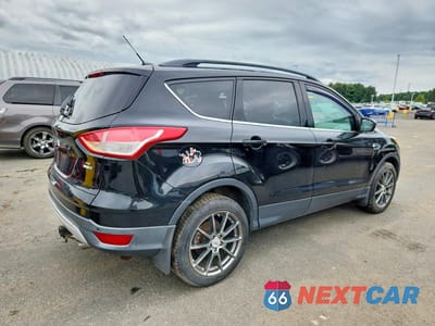 Trzecie zdjęcie samochodu z tyłu: 2016 FORD ESCAPE SE VIN:1FMCU9G99GUC31956 - miniatura