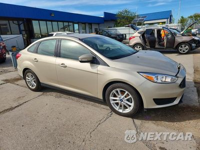 Czwarte zdjęcie samochodu z boku: 2017 FORD FOCUS SE VIN:1FADP3F25HL318364 - miniatura