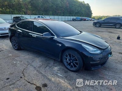 Czwarte zdjęcie samochodu z boku: 2019 TESLA MODEL 3 VIN:5YJ3E1EBXKF208535 - miniatura