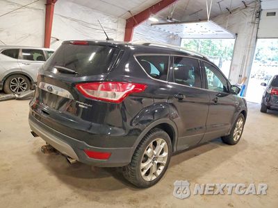 Trzecie zdjęcie samochodu z tyłu: 2016 FORD ESCAPE TITANIUM VIN:1FMCU9JX4GUA51713 - miniatura
