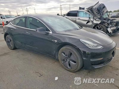 Czwarte zdjęcie samochodu z boku: 2018 TESLA MODEL 3 VIN:5YJ3E1EB7JF118709 - miniatura