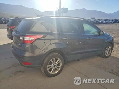 Trzecie zdjęcie samochodu z tyłu: 2018 FORD ESCAPE SE VIN:1FMCU9GDXJUD04943 - miniatura
