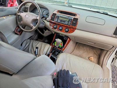 Zdjęcie 8 z 12 samochodu: 2004 TOYOTA CAMRY LE VIN:JTDBE32K640286436 - miniatura