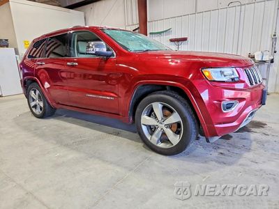 Czwarte zdjęcie samochodu z boku: 2014 JEEP GRAND CHEROKEE OVERLAND VIN:1C4RJFCG2EC437701 - miniatura